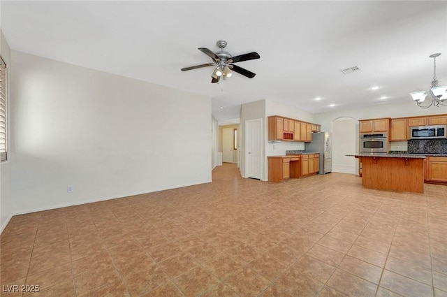 11444 Steponia Bay St, Las Vegas, NV 89141 - unfurnished living room featuring ceiling fan, a chandelier, arched walkways, and recessed lighting