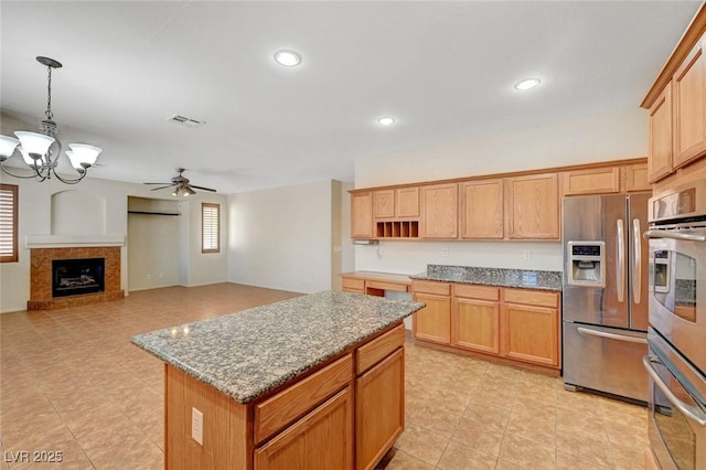 11444 Steponia Bay St, Las Vegas, NV 89141 - kitchen featuring stainless steel appliances, a chandelier, ceiling fan, light stone countertops, and open shelves