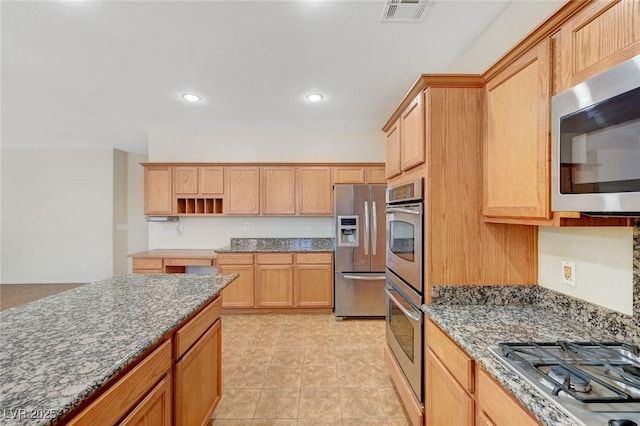 11444 Steponia Bay St, Las Vegas, NV 89141 - kitchen featuring appliances with stainless steel finishes, stone counters, open shelves, light tile patterned flooring, and recessed lighting