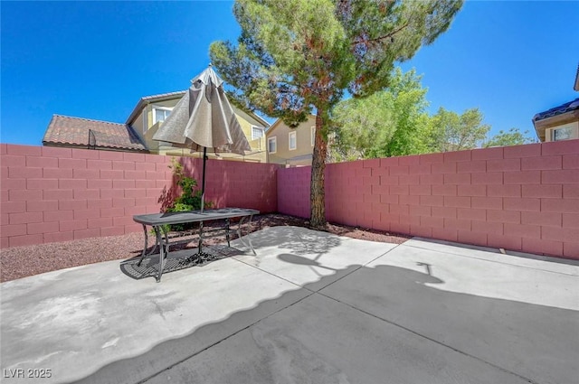 11444 Steponia Bay St, Las Vegas, NV 89141 - view of patio featuring a fenced backyard and outdoor dining area