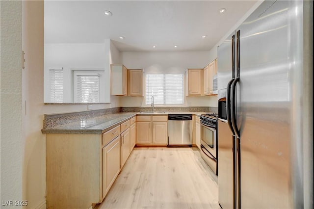 5250 S Rainbow Blvd Unit 2183, Las Vegas, NV 89118 - kitchen with appliances with stainless steel finishes, light brown cabinets, light wood-style floors, a sink, and recessed lighting