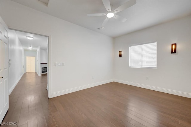 5250 S Rainbow Blvd Unit 2183, Las Vegas, NV 89118 - unfurnished room featuring dark wood finished floors, baseboards, and a ceiling fan