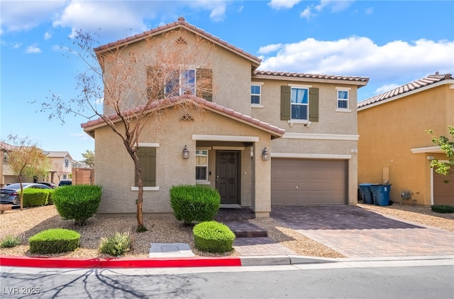 3855 Park Field Dr, Las Vegas, NV 89120 - view of front of home with a tile roof, stucco siding, an attached garage, and driveway