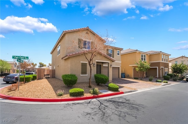 3855 Park Field Dr, Las Vegas, NV 89120 - view of front facade featuring stucco siding, a tiled roof, a garage, and a residential view