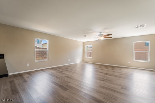 3855 Park Field Dr, Las Vegas, NV 89120 - unfurnished room with a ceiling fan, wood finished floors, and baseboards