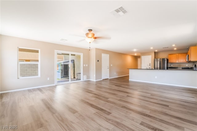 3855 Park Field Dr, Las Vegas, NV 89120 - unfurnished living room with light wood-style flooring, ceiling fan, recessed lighting, and baseboards