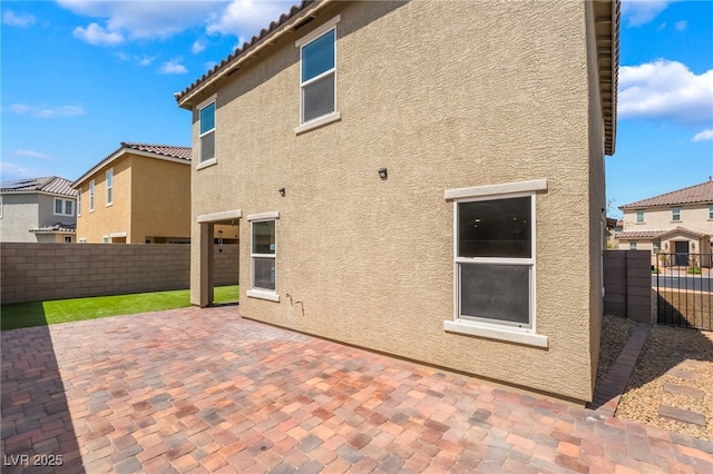 3855 Park Field Dr, Las Vegas, NV 89120 - back of property with stucco siding, a patio area, a fenced backyard, and a residential view