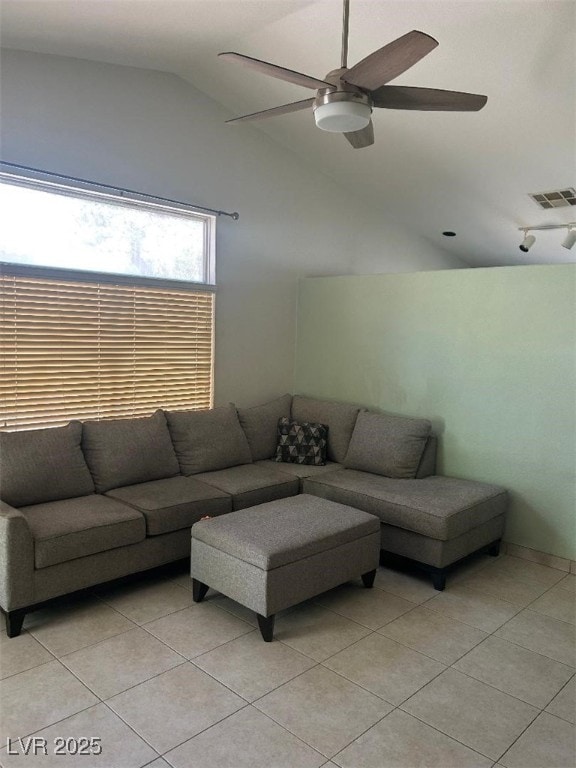 5544 Cloudy Glen St, North Las Vegas, NV 89031 - living room with light tile patterned floors, lofted ceiling, and a ceiling fan