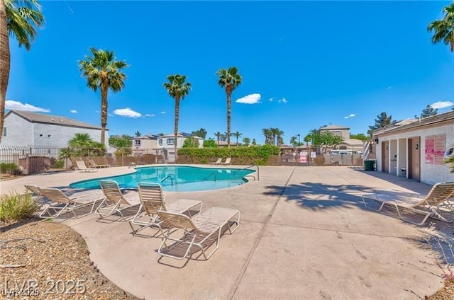 9979 Keephills St, Las Vegas, NV 89183 - community pool with fence and a patio area
