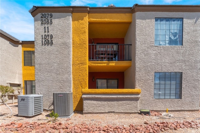2700 N Rainbow Blvd Unit 1080, Las Vegas, NV 89108 - rear view of property featuring a balcony, central air condition unit, and stucco siding