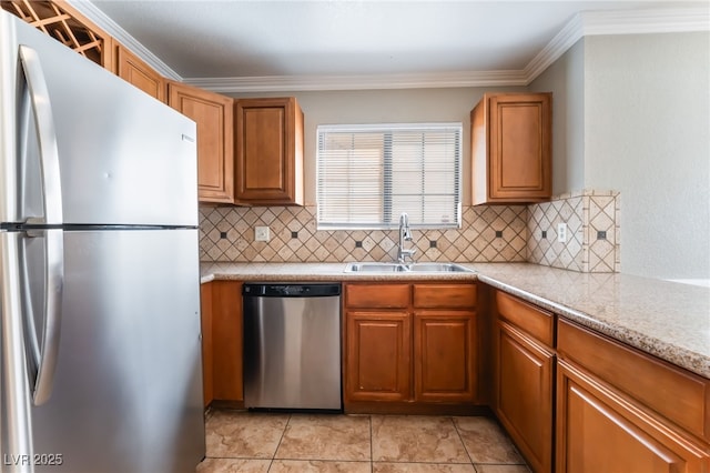 2700 N Rainbow Blvd Unit 1080, Las Vegas, NV 89108 - kitchen featuring appliances with stainless steel finishes, a sink, decorative backsplash, ornamental molding, and brown cabinets
