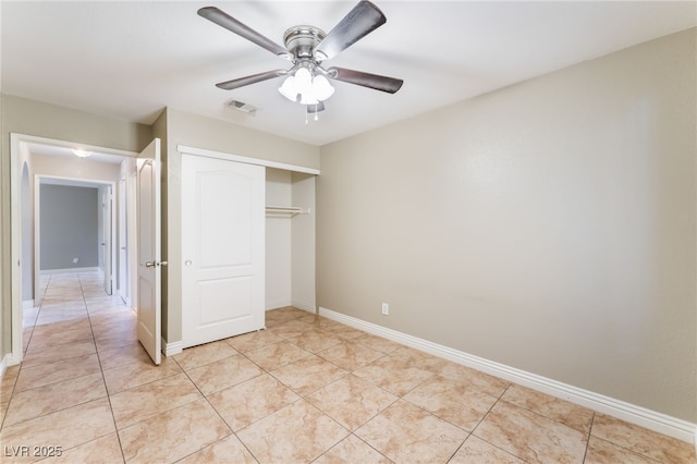 2700 N Rainbow Blvd Unit 1080, Las Vegas, NV 89108 - unfurnished bedroom featuring a closet, light tile patterned flooring, ceiling fan, and baseboards