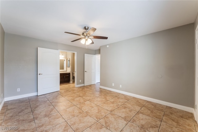 2700 N Rainbow Blvd Unit 1080, Las Vegas, NV 89108 - unfurnished bedroom with light tile patterned floors, baseboards, a ceiling fan, and ensuite bathroom