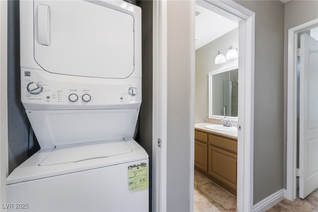 2700 N Rainbow Blvd Unit 1080, Las Vegas, NV 89108 - washroom featuring stacked washing machine and dryer and a sink