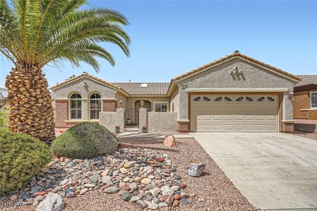 2810 Somerset Springs Dr, Henderson, NV 89052 - view of front of property with a tiled roof, driveway, a gate, an attached garage, and stucco siding
