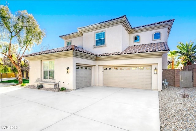 5737 Heather Breeze Ct, Las Vegas, NV 89141 - mediterranean / spanish home featuring a garage, driveway, fence, and stucco siding