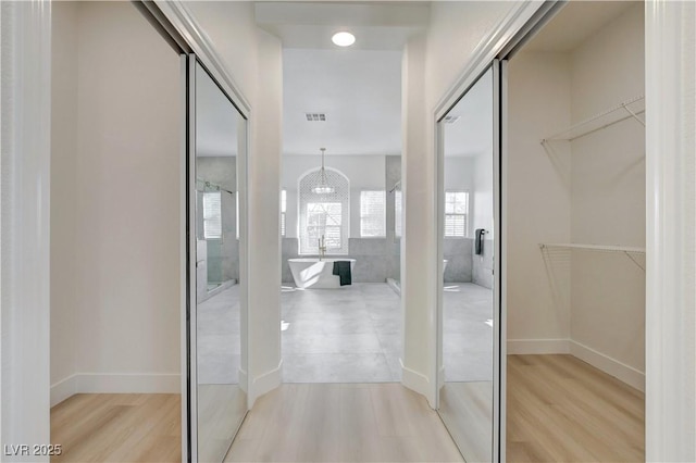 5737 Heather Breeze Ct, Las Vegas, NV 89141 - hallway featuring light wood-style floors and baseboards