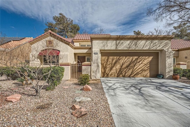 2520 Palmridge Dr, Las Vegas, NV 89134 - mediterranean / spanish-style home with a garage, driveway, stucco siding, a tiled roof, and a gate