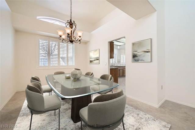 2520 Palmridge Dr, Las Vegas, NV 89134 - dining space featuring a chandelier, plenty of natural light, and baseboards