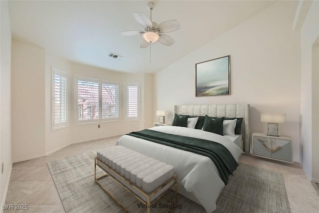 2520 Palmridge Dr, Las Vegas, NV 89134 - bedroom with vaulted ceiling, light tile patterned floors, a ceiling fan, and baseboards