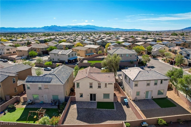 aerial view of residential area with mountains