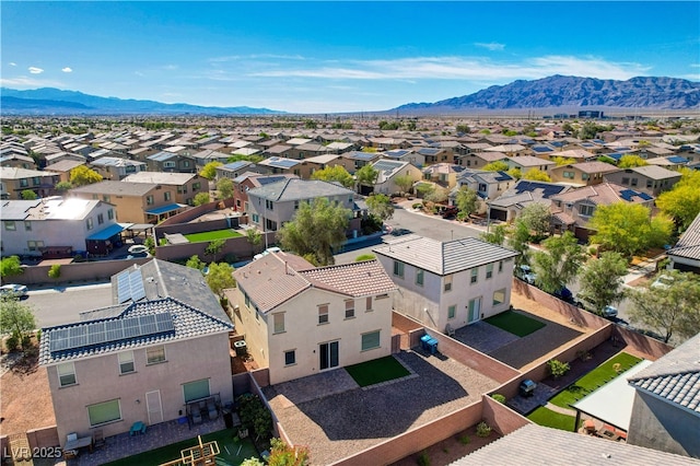 aerial view of residential area featuring a mountainous background
