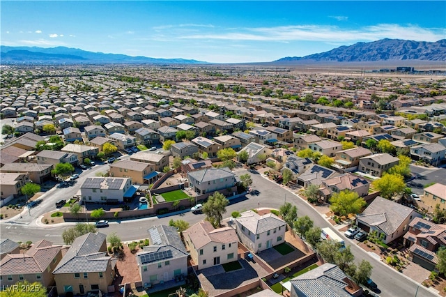 aerial view of residential area featuring mountains