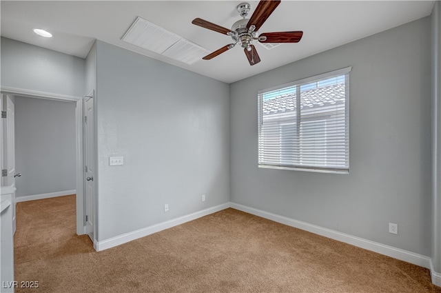 unfurnished room with carpet floors, a ceiling fan, and baseboards