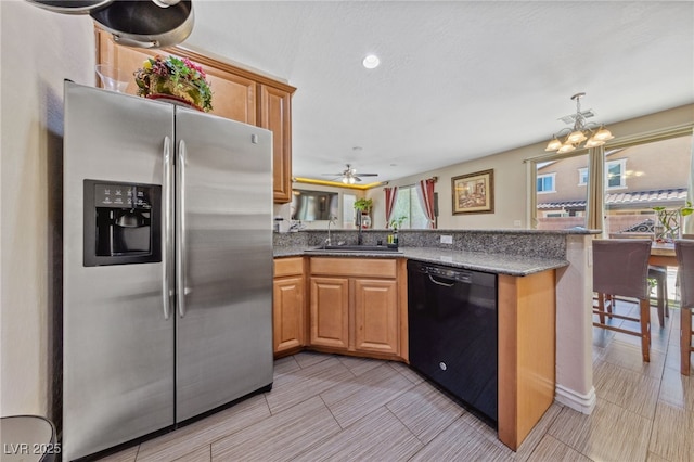 kitchen featuring stainless steel fridge with ice dispenser, dishwasher, a sink, a peninsula, and ceiling fan
