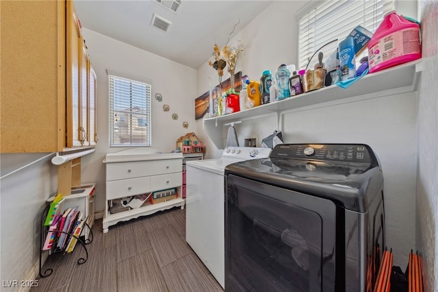 washroom featuring washing machine and clothes dryer