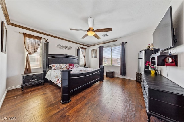 bedroom with hardwood / wood-style floors, baseboards, a ceiling fan, and ornamental molding