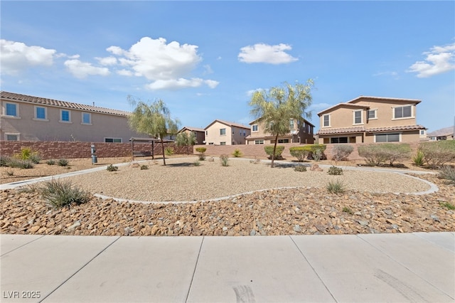 view of yard with a residential view and fence
