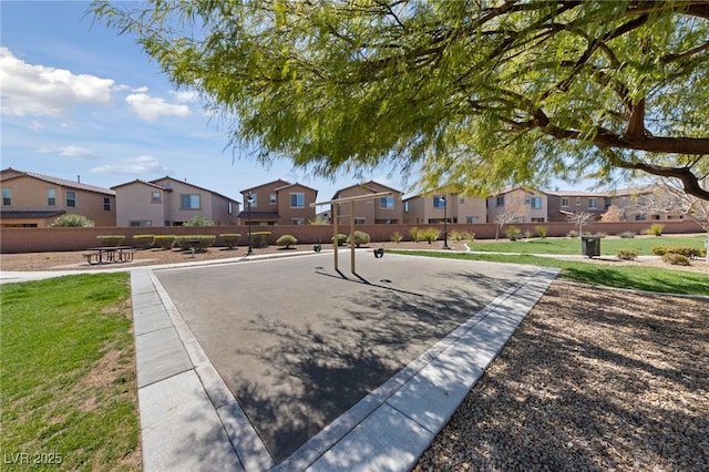 view of property's community featuring a residential view and a yard