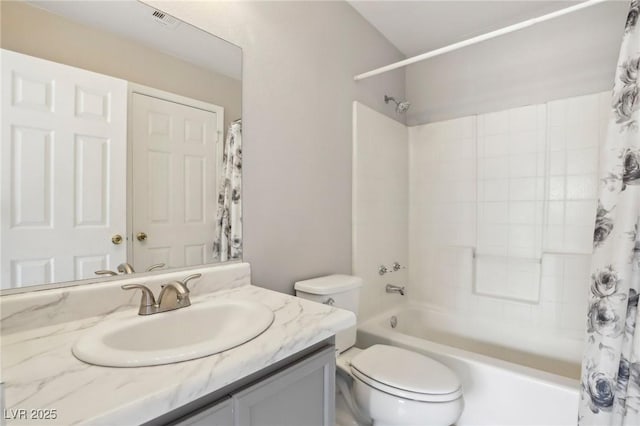 full bathroom featuring toilet, vanity, and shower / bath combo with shower curtain