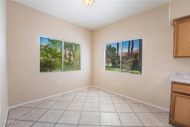 1050 E Cactus Ave Unit 1128, Las Vegas, NV 89183 - spare room featuring baseboards and light tile patterned flooring