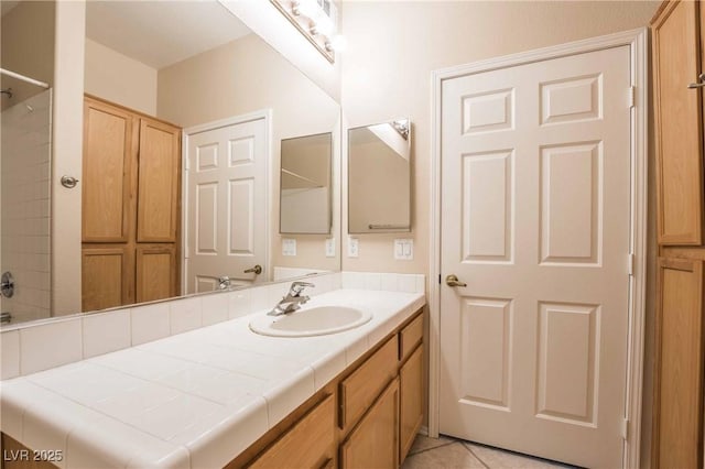 1050 E Cactus Ave Unit 1128, Las Vegas, NV 89183 - full bath featuring vanity, tile patterned floors, and a shower
