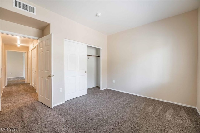 1050 E Cactus Ave Unit 1128, Las Vegas, NV 89183 - unfurnished bedroom featuring carpet flooring, baseboards, and a closet