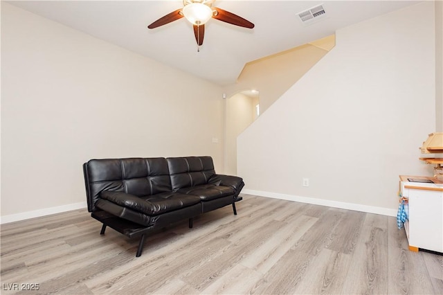 8717 Early Horizon Dr, Las Vegas, NV 89178 - living area with wood finished floors, ceiling fan, baseboards, vaulted ceiling, and arched walkways