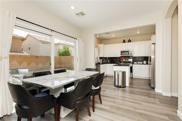 8717 Early Horizon Dr, Las Vegas, NV 89178 - dining room with light wood finished floors, recessed lighting, and baseboards