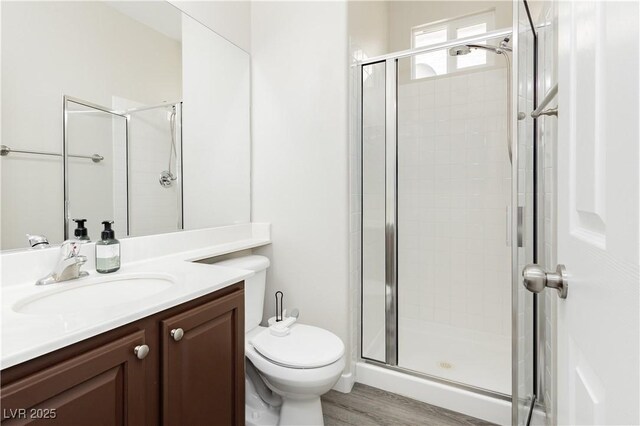 8717 Early Horizon Dr, Las Vegas, NV 89178 - bathroom featuring a shower stall, vanity, and toilet