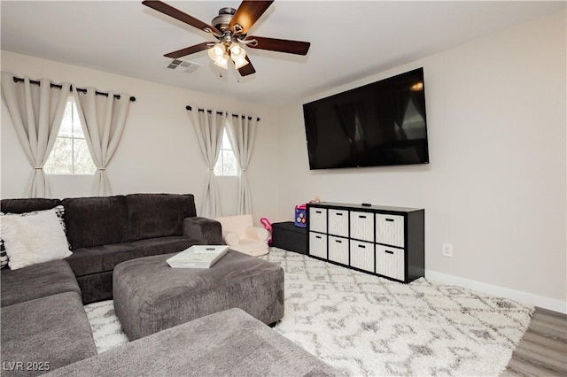 8717 Early Horizon Dr, Las Vegas, NV 89178 - living area with a ceiling fan, wood finished floors, and baseboards
