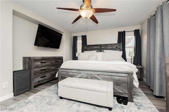 8717 Early Horizon Dr, Las Vegas, NV 89178 - bedroom featuring wood finished floors, baseboards, and a ceiling fan