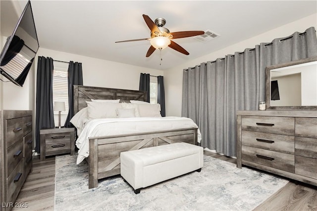 8717 Early Horizon Dr, Las Vegas, NV 89178 - bedroom featuring light wood-style flooring and a ceiling fan