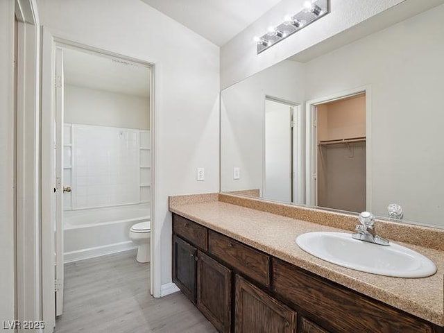 4830 Double Down Dr Unit 102, Las Vegas, NV 89122 - full bath with vanity, wood finished floors, toilet, and shower / bathtub combination