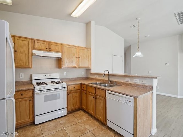 4830 Double Down Dr Unit 102, Las Vegas, NV 89122 - kitchen with white appliances, under cabinet range hood, a sink, a peninsula, and lofted ceiling