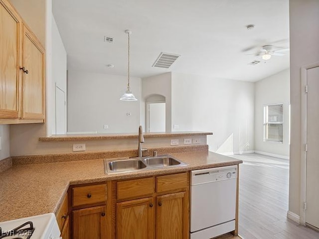 4830 Double Down Dr Unit 102, Las Vegas, NV 89122 - kitchen featuring dishwasher, a sink, arched walkways, a peninsula, and ceiling fan