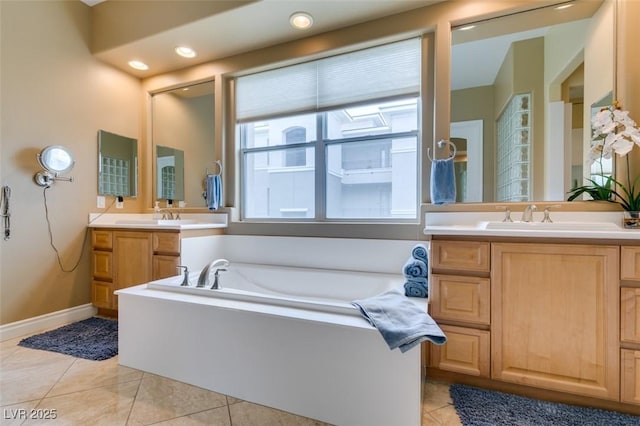 9201 Tesoras Dr Unit 302, Las Vegas, NV 89144 - full bath featuring tile patterned flooring, a garden tub, vanity, baseboards, and recessed lighting