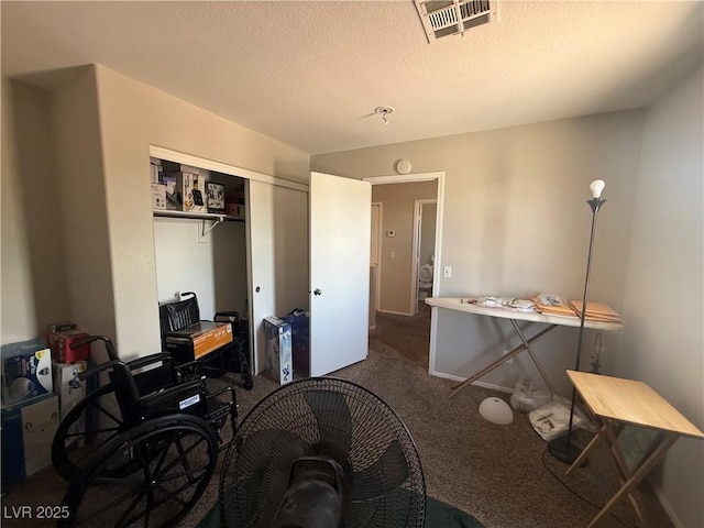 office space featuring carpet flooring and a textured ceiling