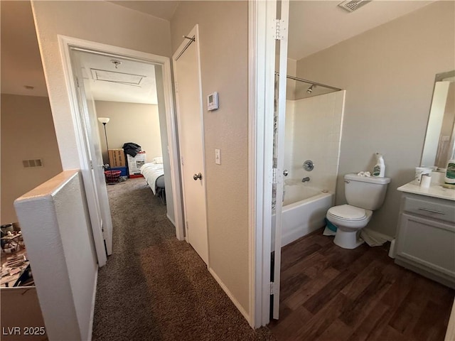 full bathroom featuring shower / tub combination, wood finished floors, toilet, and vanity