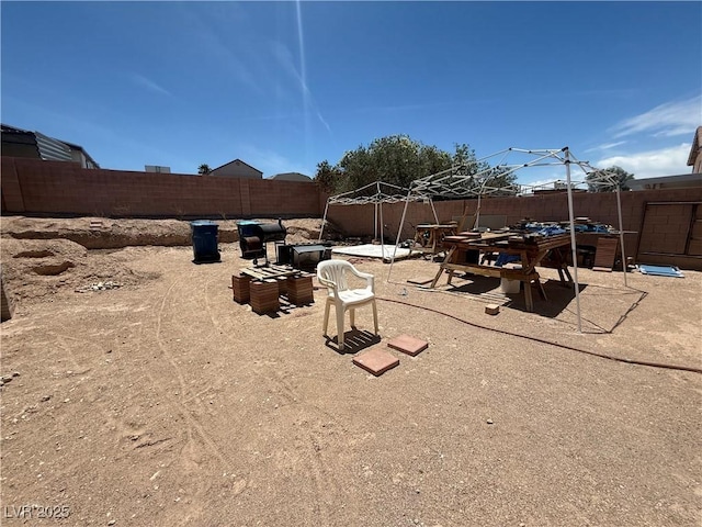 fenced backyard featuring a patio area